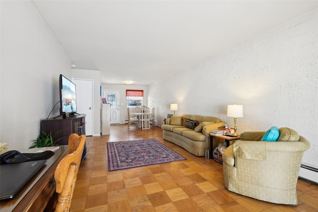 living room with parquet flooring and a baseboard radiator