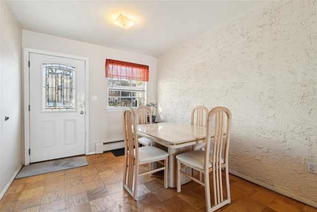 dining room featuring baseboard heating