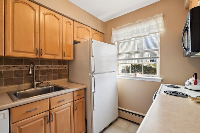 kitchen featuring white appliances, sink, decorative backsplash, and a baseboard heating unit