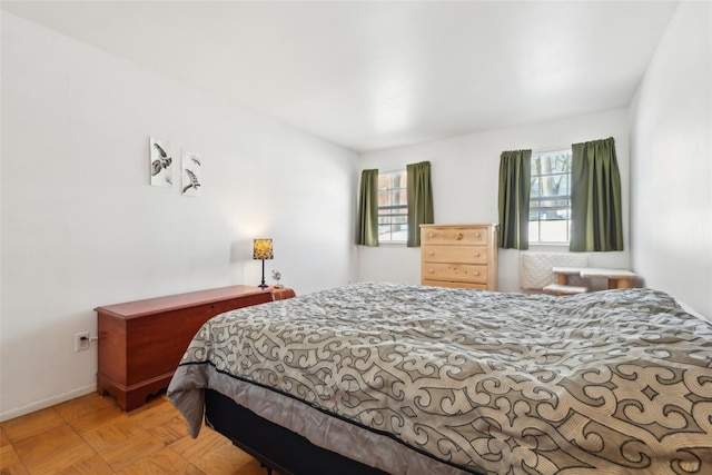 bedroom featuring light parquet floors