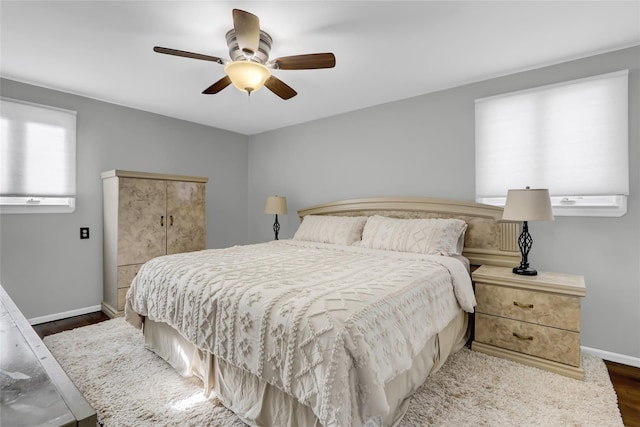 bedroom featuring ceiling fan and dark hardwood / wood-style floors