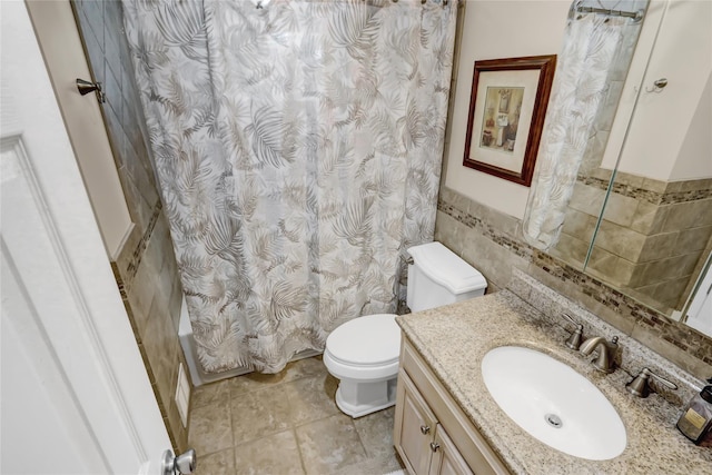 full bathroom with toilet, vanity, tile walls, and shower / tub combo