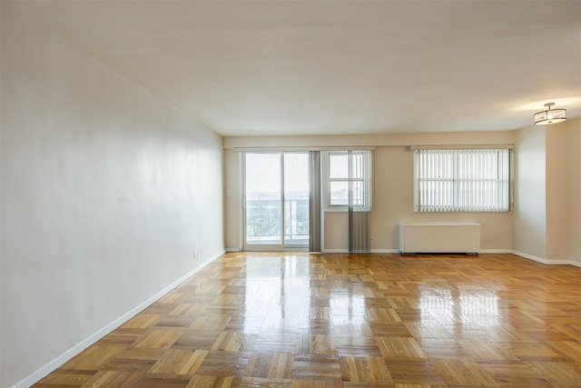 unfurnished room featuring light parquet floors