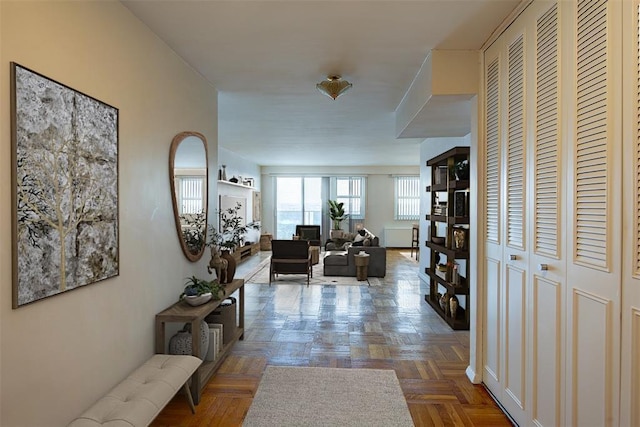 corridor featuring parquet floors