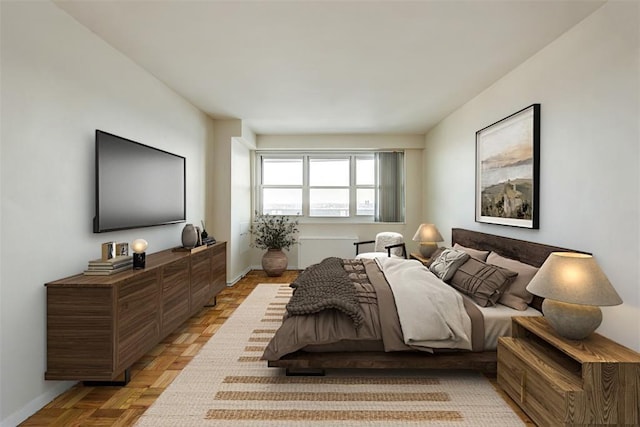 bedroom featuring light parquet flooring