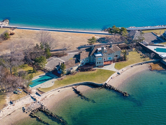 bird's eye view featuring a water view and a view of the beach