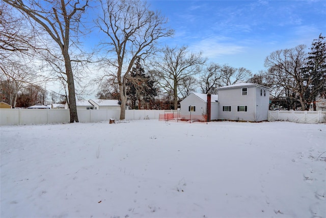 view of yard layered in snow