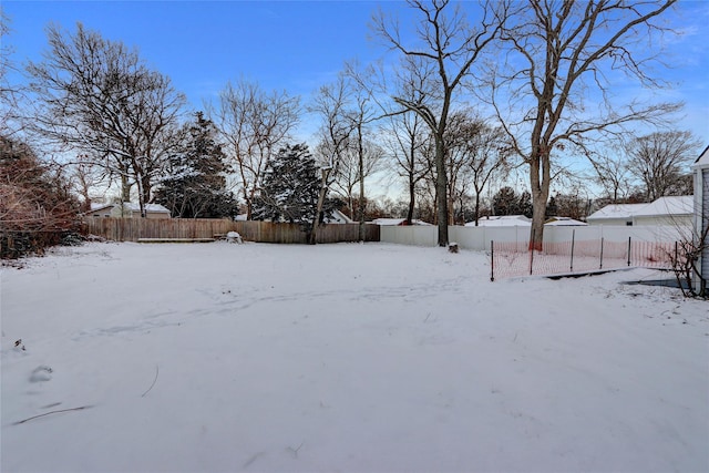 view of yard layered in snow