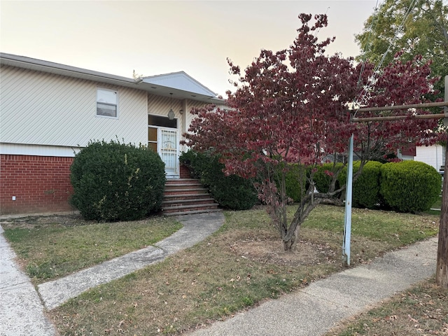 view of front of house with a lawn