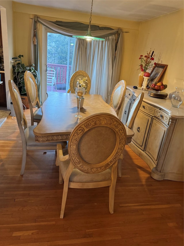 dining area with hardwood / wood-style floors