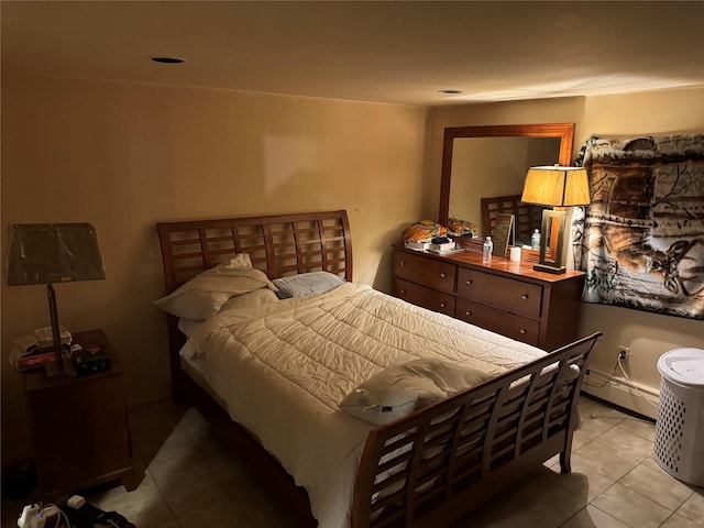 tiled bedroom featuring a baseboard radiator