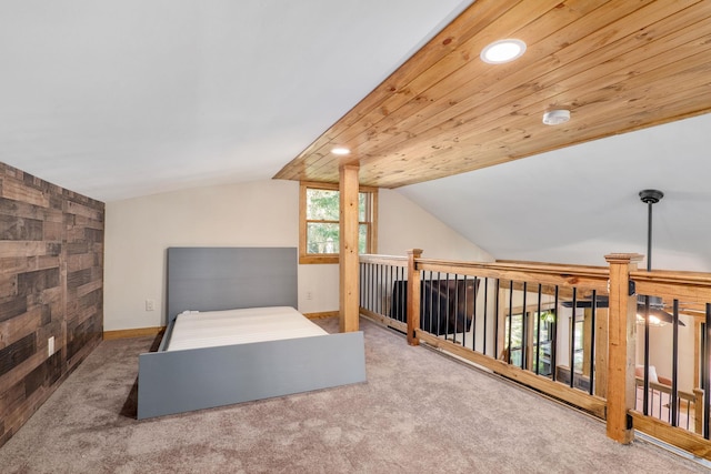 carpeted bedroom with lofted ceiling and wood ceiling