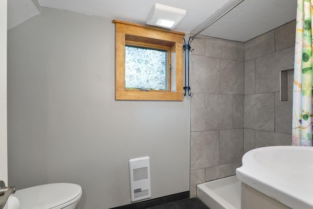 bathroom with toilet, tile patterned floors, a shower with curtain, sink, and heating unit