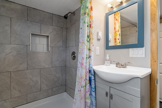 bathroom featuring vanity and a shower with shower curtain