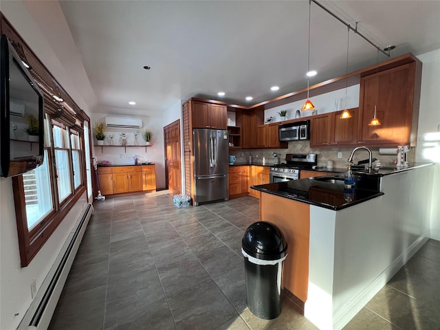 kitchen with sink, a baseboard heating unit, hanging light fixtures, stainless steel appliances, and a wall mounted AC