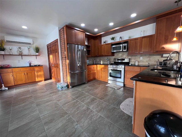 kitchen featuring decorative backsplash, stainless steel appliances, sink, and a wall unit AC