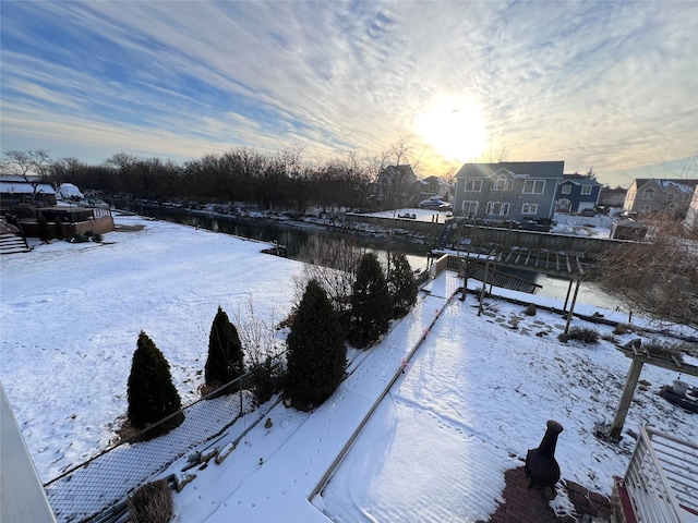 view of yard layered in snow