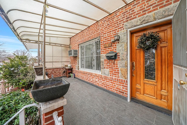 property entrance with a wall unit AC