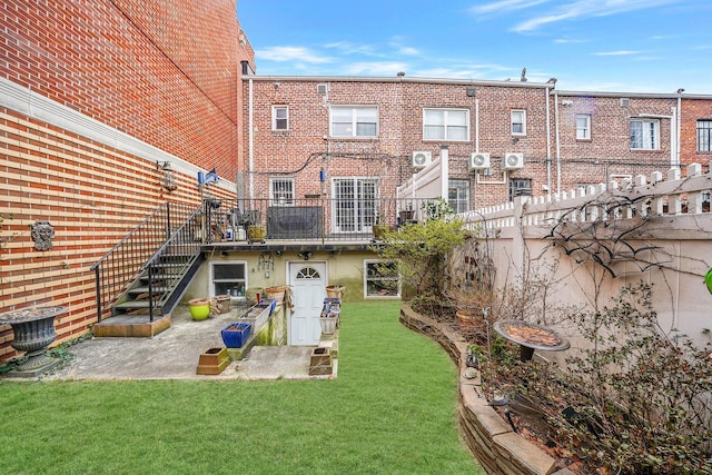 rear view of house with a lawn