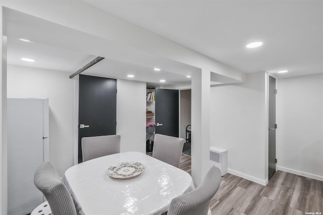 dining space with light wood-type flooring