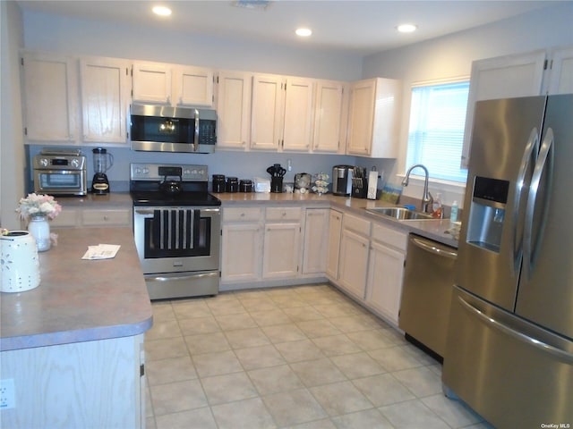 kitchen with appliances with stainless steel finishes and sink