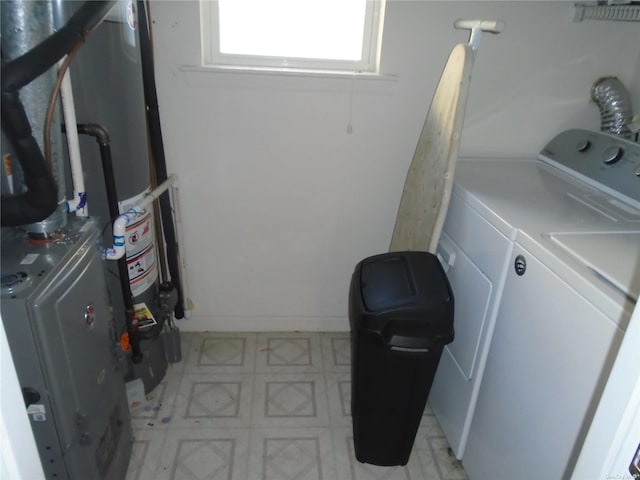 clothes washing area featuring washer and dryer