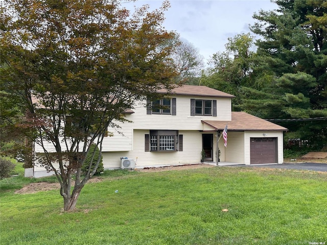 view of front facade featuring a garage and a front lawn