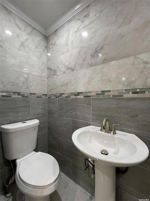 bathroom featuring toilet and ornamental molding