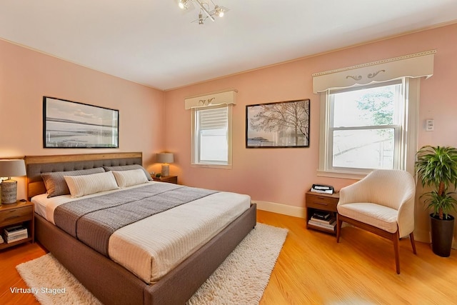 bedroom with light hardwood / wood-style floors