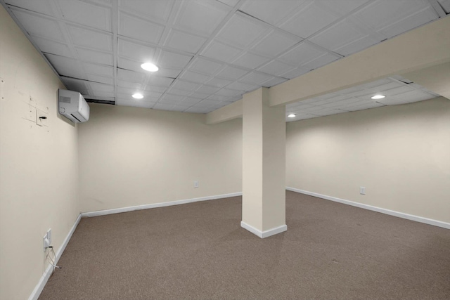 basement with a wall mounted AC and carpet