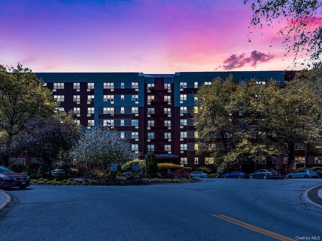 view of outdoor building at dusk