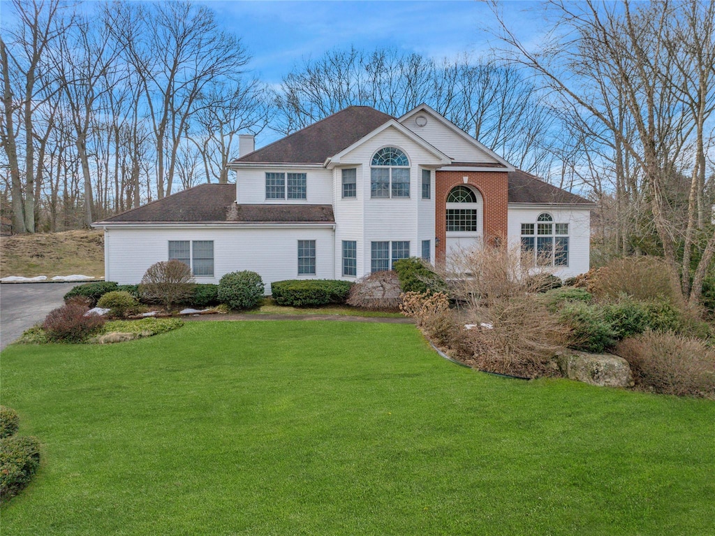 view of front of property with a front lawn