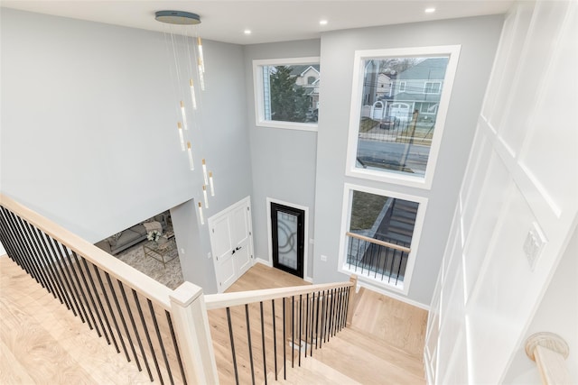 stairs with wood-type flooring