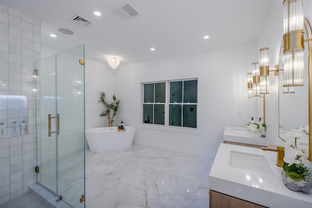 bathroom featuring vanity and independent shower and bath