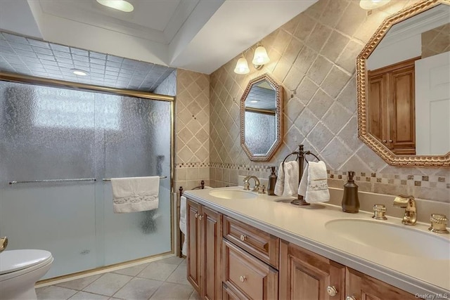 bathroom with tile walls, ornamental molding, toilet, walk in shower, and vanity