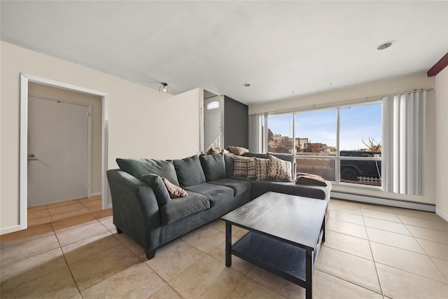 living room with light tile patterned floors and a baseboard radiator