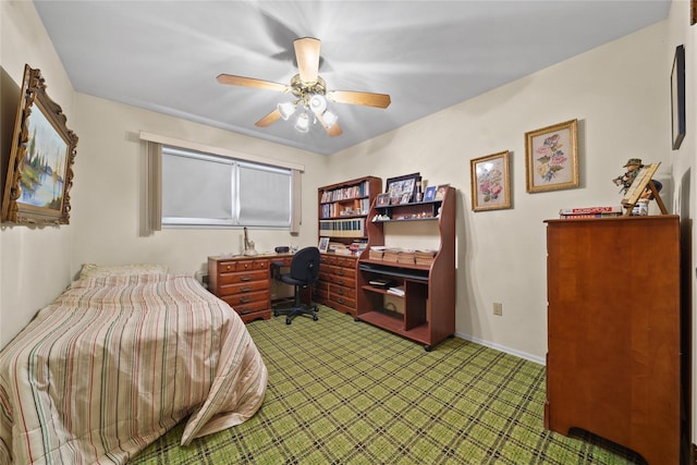 bedroom featuring ceiling fan and carpet