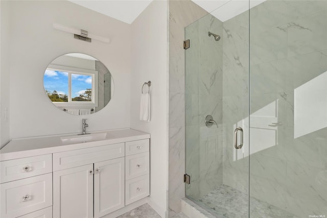 bathroom featuring an enclosed shower and vanity