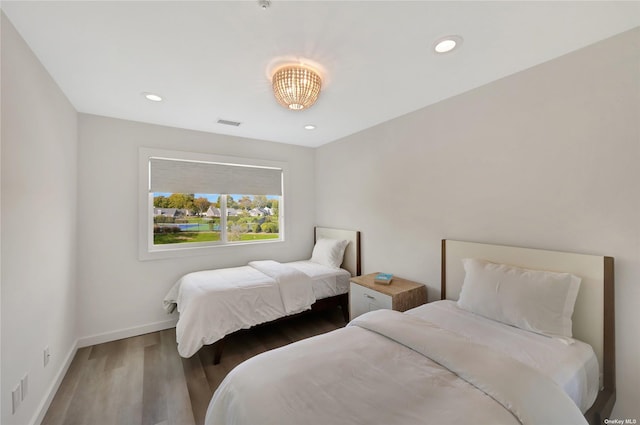 bedroom featuring wood-type flooring