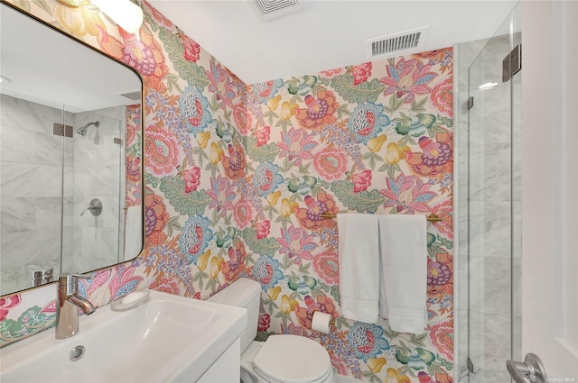 bathroom featuring sink, toilet, and an enclosed shower