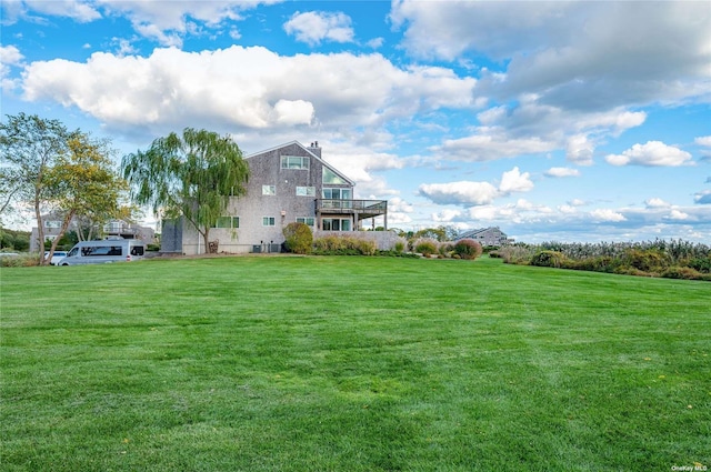 view of yard featuring a wooden deck