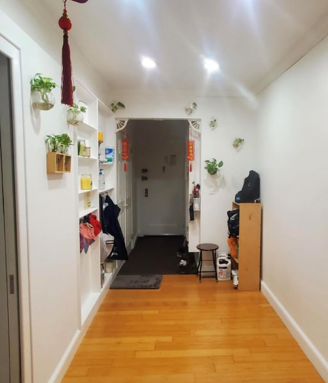 hall with light hardwood / wood-style flooring