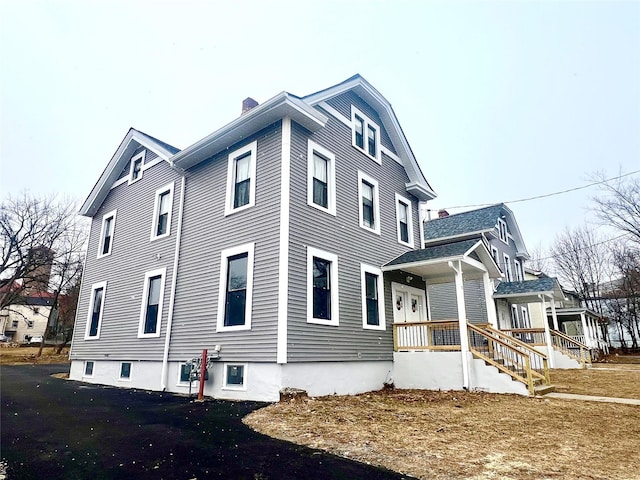 view of property exterior with a porch