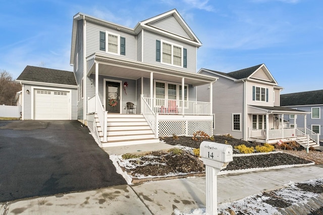 view of front of property with covered porch and a garage