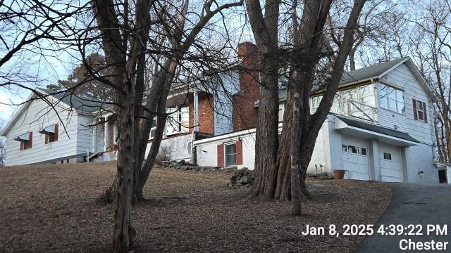 view of property exterior with a garage