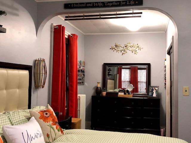 bedroom with radiator and ornamental molding