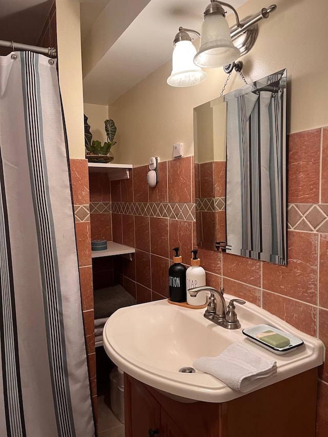 bathroom with tile walls and vanity