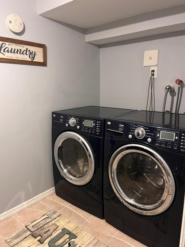 laundry area with independent washer and dryer