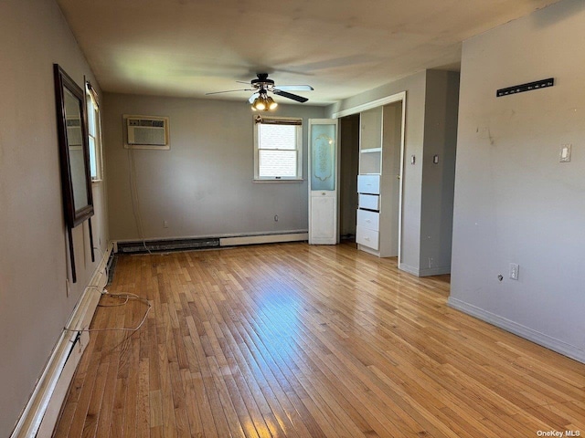 empty room featuring ceiling fan, light hardwood / wood-style flooring, a baseboard heating unit, and a wall unit AC