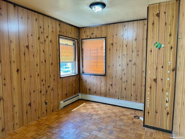 empty room with parquet floors and wooden walls